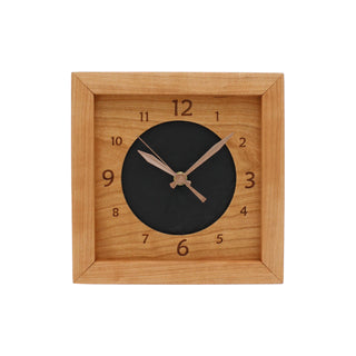 Leather & Cherry, handcrafted cherry wooden box clock featuring a numbered cherry face with cutout revealing black leather circle in the center.