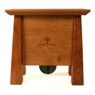 Back view: Cherry wood clock with 4 tapered legs, centered Sabbath-Day Woods logo.