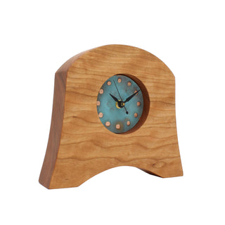 Wooden bell-shaped clock made from sustainable Appalachian Cherry with round green patina copper face. Angle view, American Liberty Mantel Clock