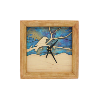 Bird on a Branch - Azure Sky, handcrafted Cherry Wooden Box Clock with Bird on a Branch design in maple over a blue swirled paper background.
