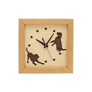 Dogs at Play, handcrafted cherry wooden Box Clock with dog design in maple over a walnut background.