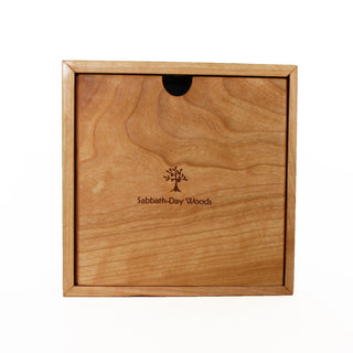 Square clock framed with cherry wood and a walnut & maple face of bird on a branch design. Back view