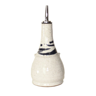 White cruet with cobalt blue accent lines around the top.