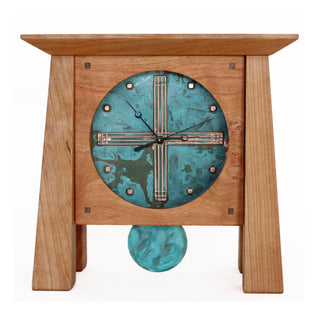 Cherry wood mantel clock with four tapered legs, patina copper face and pendulum.
