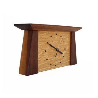 Side view: tapered rectangular walnut wood framed oak wood clock.