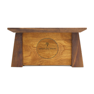 Back view: tapered rectangular walnut wood framed oak clock with Sabbath-Day Woods logo centered.